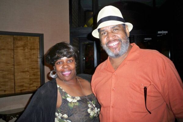 Eurie Stamps smiles with his wife Norma.