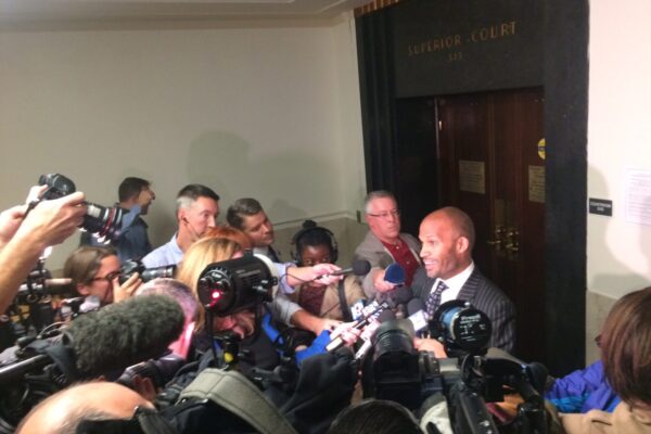 Former ACLU of Massachusetts staff attorney Carl Williams speaking to reporters after the September 6 hearing