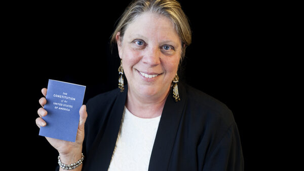 Carol Rose holding the Constitution