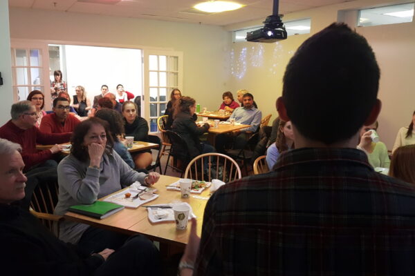 Olivia Santoro speaks to room of volunteers