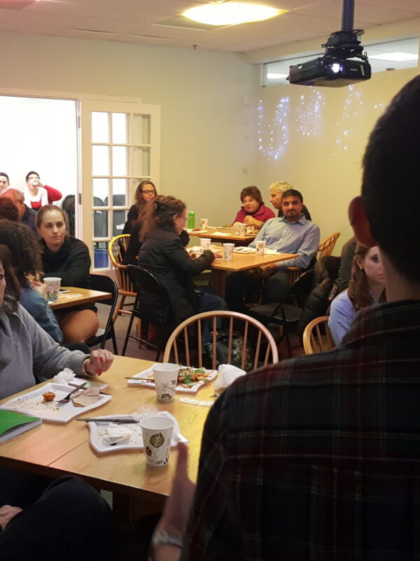 Olivia Santoro speaks to room of volunteers