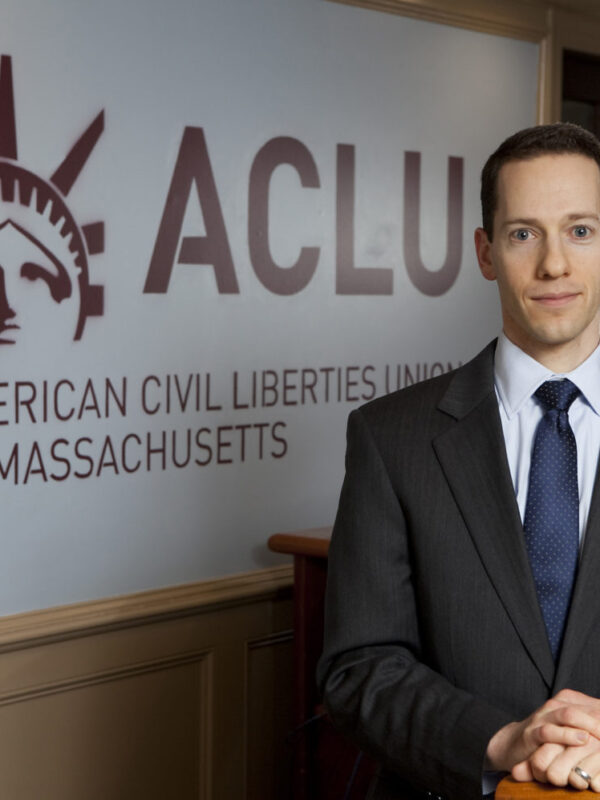Matthew Segal in front of ACLU Logo