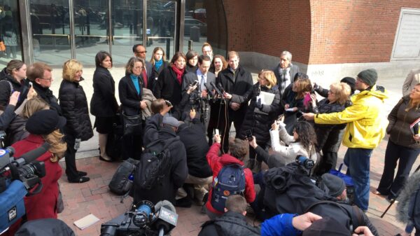 Matthew Segal speaks to reporters outside the Boston federal court following the February 1st hearing on Louhghalam v. Trump