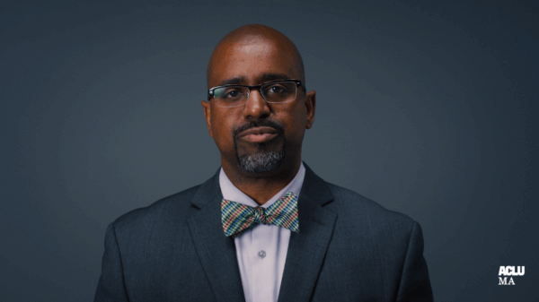 Rahsaan Hall, director of the ACLU of Massachusetts' Racial Justice Program and What a Difference a DA Makes campaign manager in front of a gray background
