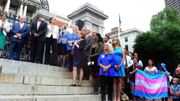 Supporters of transgender rights line the steps of the Massachusetts State House during the citizens signing of the transgender anti-discrimination bill