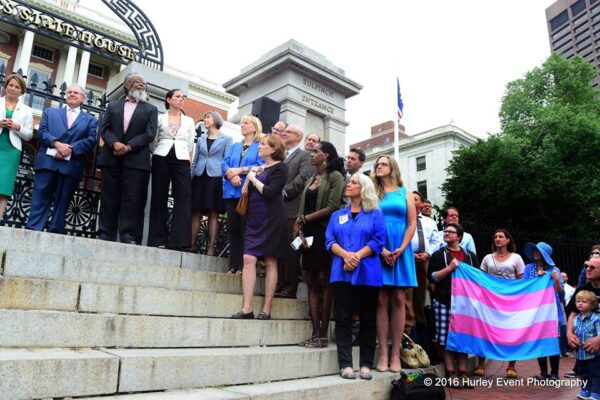 Supporters of transgender rights line the steps of the Massachusetts State House during the citizens signing of the transgender anti-discrimination bill