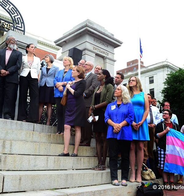 Supporters of transgender rights line the steps of the Massachusetts State House during the citizens signing of the transgender anti-discrimination bill