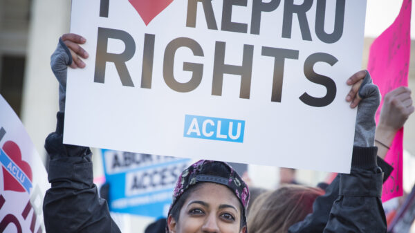 Protester holding "I Love Repro Rights" sign