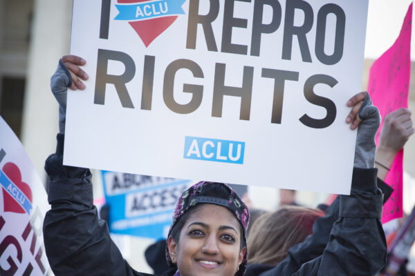 Protester holding "I Love Repro Rights" sign