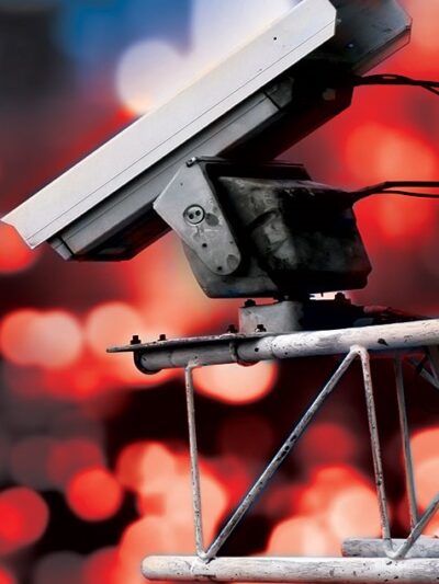 Surveillance camera high above blurred city lights