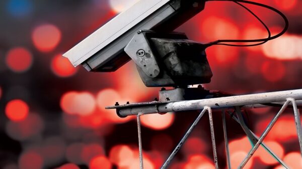 Surveillance camera high above blurred city lights