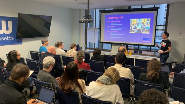 Volunteers watch ACLU staffer Olivia Santoro give a Lobbying 101 presentation