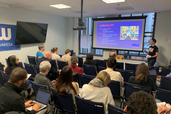 Volunteers watch ACLU staffer Olivia Santoro give a Lobbying 101 presentation