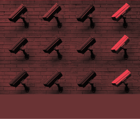 Surveillance cameras mounted on a concrete wall