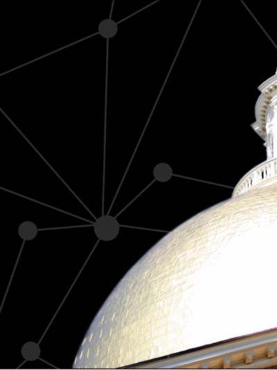 State House dome in front of black digital screen