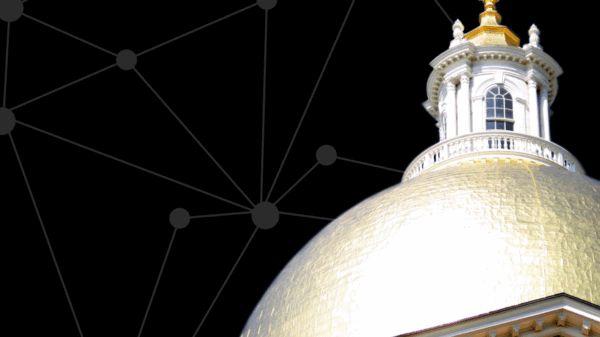State House dome in front of black digital screen