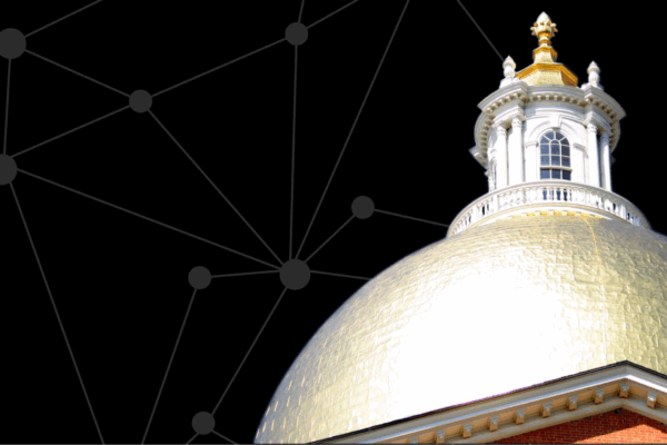 State House dome in front of black digital screen