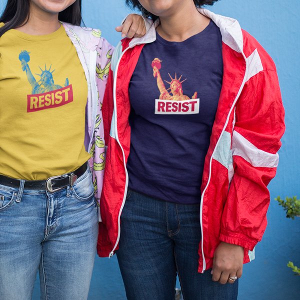 Two people wearing ACLU Resist t-shirts