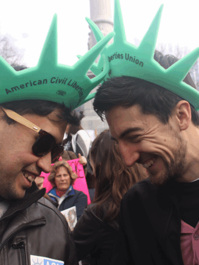 Two ACLU of Massachusetts volunteers wearing Statue of Liberty hats