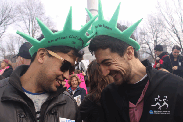 Two ACLU of Massachusetts volunteers wearing Statue of Liberty hats