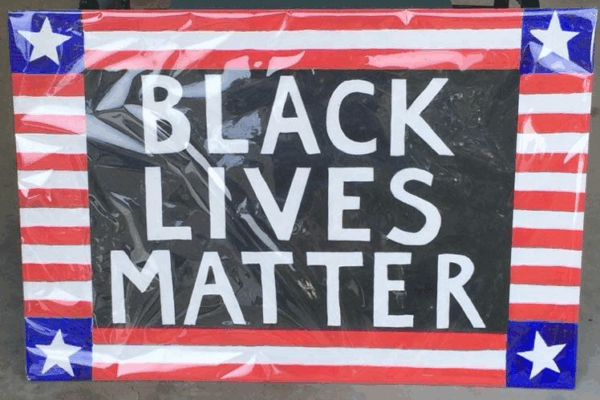 Black Lives Matter sign with patriotic flourishes