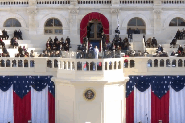 The Capitol building draped in American flags