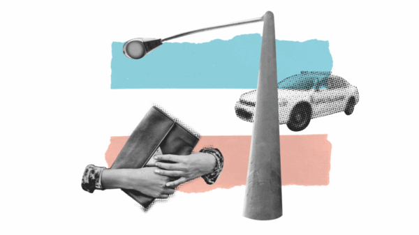 police car, lamppost, person holding wallet