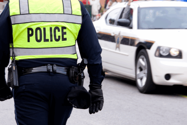 Police officer photographed from behind