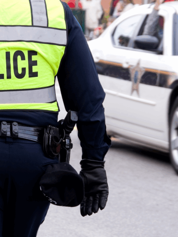Police officer photographed from behind
