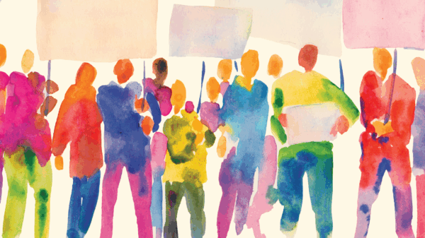 Painted figures at a protest