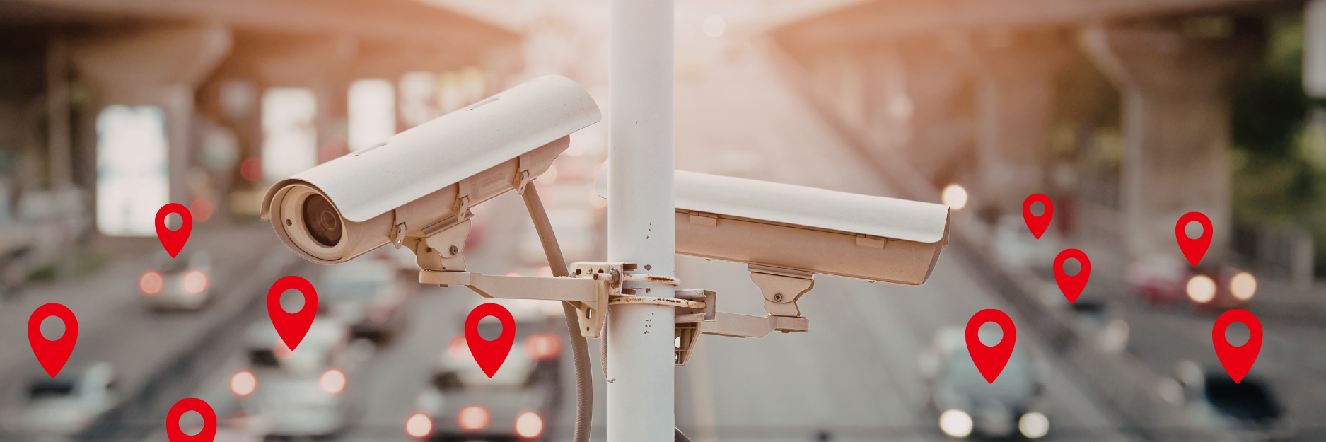 Automatic License plate readers above a highway in daylight. Location pins demonstrate tracking of vehicles in the background.