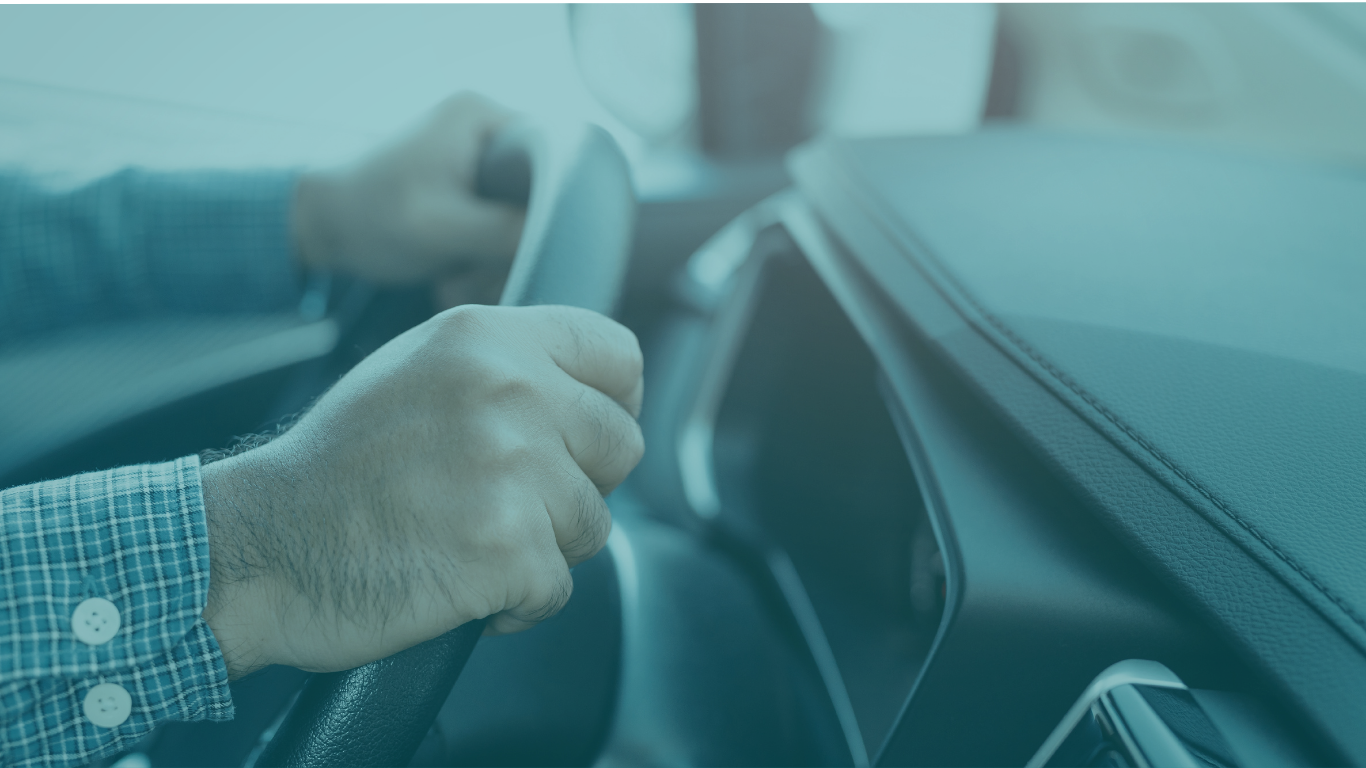 Individual driving a vehicle with light blue overlay