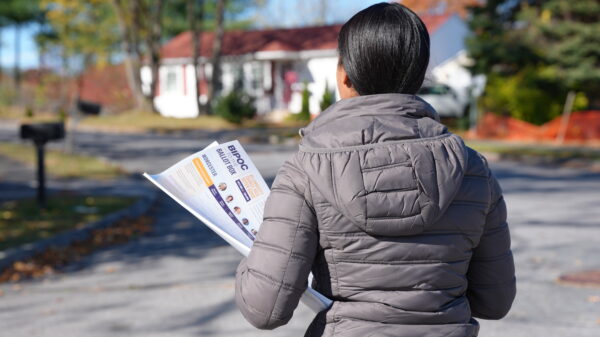 ACLU Action Team Member distributing Voter Guides in Massachusetts