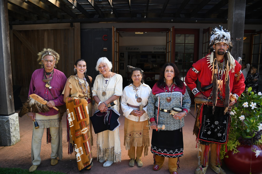 Photo of six members of the Wampanoag Nation Singers & Dancers