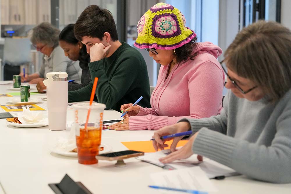 Image of people at a table participating in a workshop