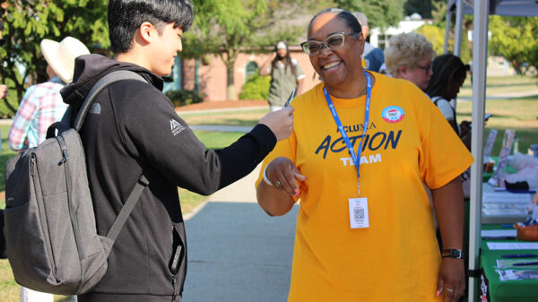 ACLU member giving out know your rights wallet card