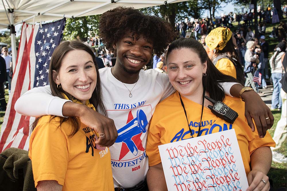 ACLU members at a table at a festival to inspire youth to get involved