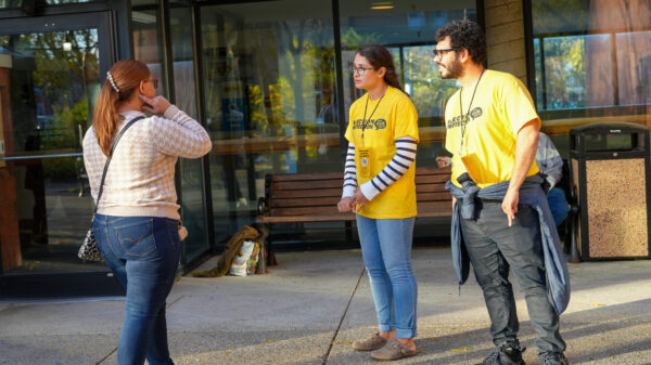 Two Poll Monitors wear yellow t-shirts for the Election Protection work during election day.