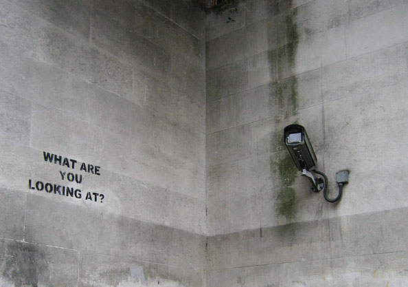 Surveillance camera and words "what are you looking at?"