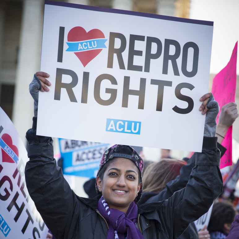 Protester holding "I Love Repro Rights" sign