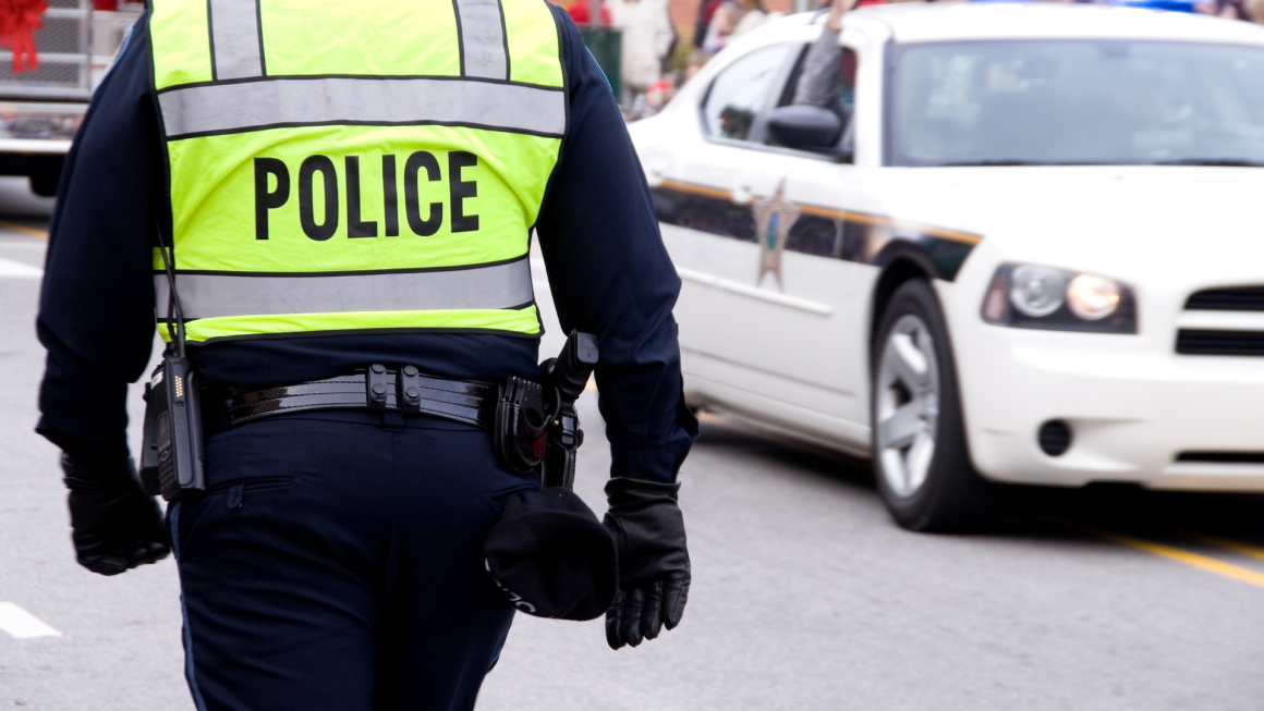 Police officer photographed from behind