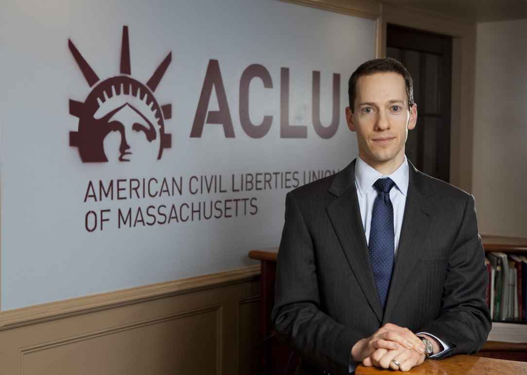 Matthew Segal in front of ACLU Logo