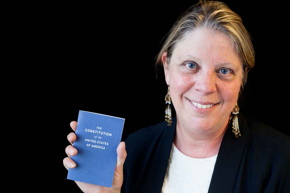 Carol Rose holding the Constitution