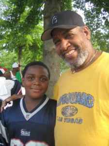 Eurie Stamps stands with his grandson Christian.