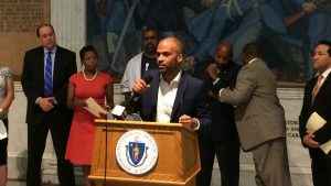 Staff attorney Carl Williams at the podium