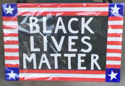 Black Lives Matter sign with patriotic flourishes