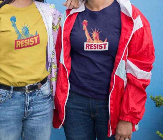 Two people wearing ACLU Resist t-shirts